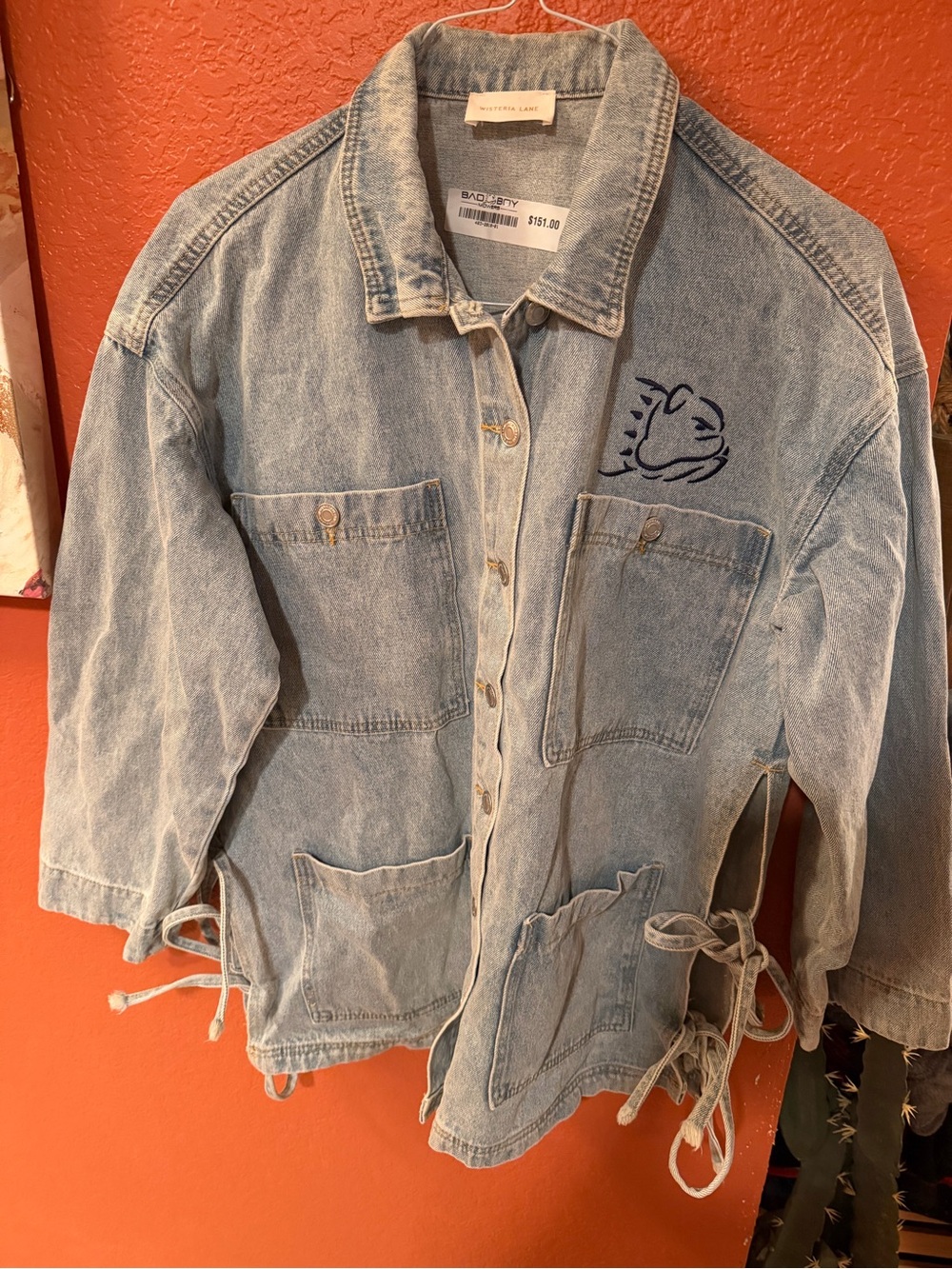 Vintage-Inspired Light Blue Denim Jacket with Embroidered Detail